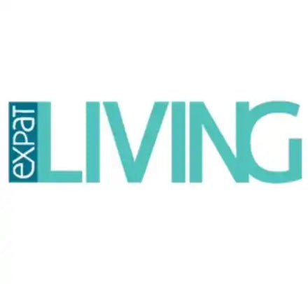 Teal and white ’EXPAT LIVING’ text logo.