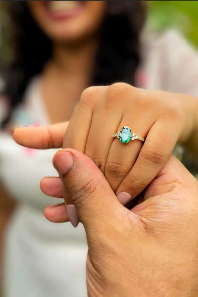A turquoise gemstone ring worn on a finger.